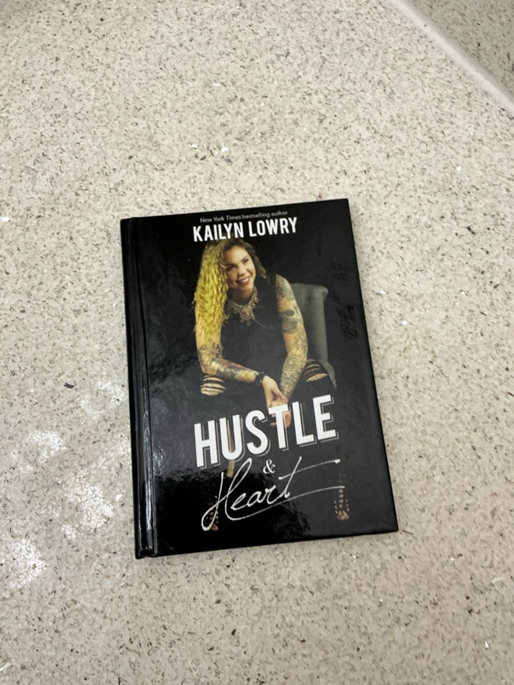 Hustler Hollywood Black Hardcover Book with White Title Text
